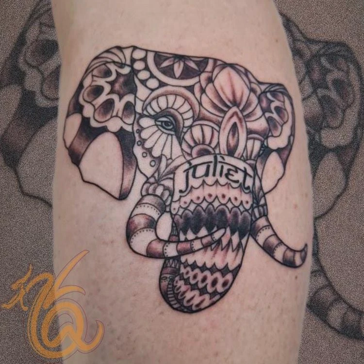 Ornate dotwork elephant head with Juliet name tattoo