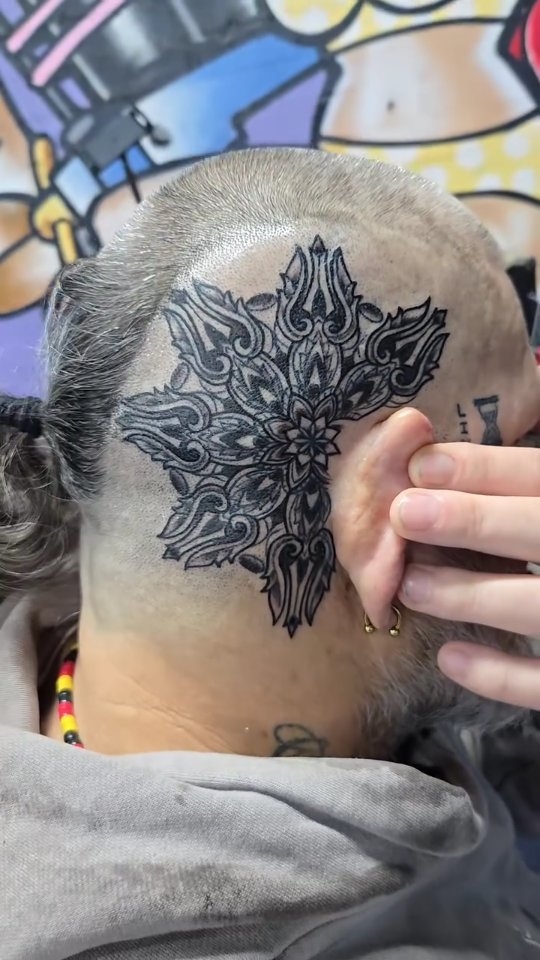 Ornate dotwork mandala scalp tattoo