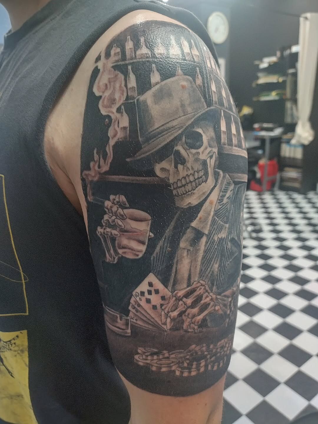 Illustrative skeleton gangster with whiskey half-sleeve